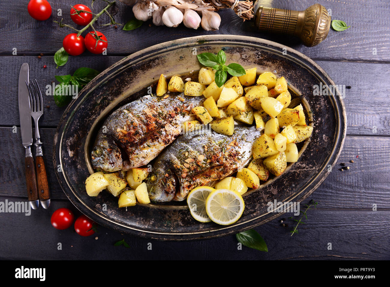 Fried bream fish with potatoes Stock Photo Alamy