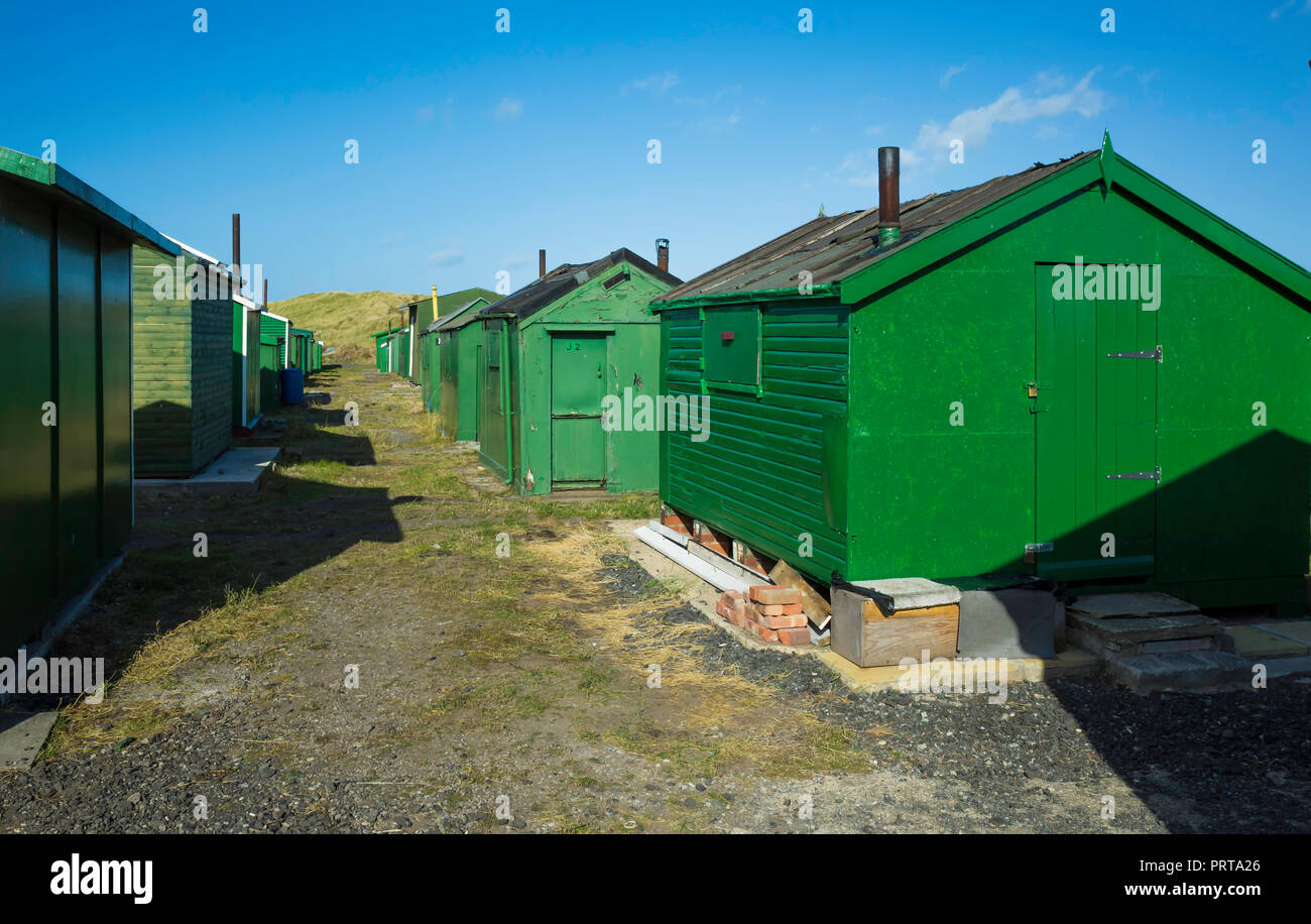Green fisherman's huts at the South Gare Teesmouth, England UK Stock Photo