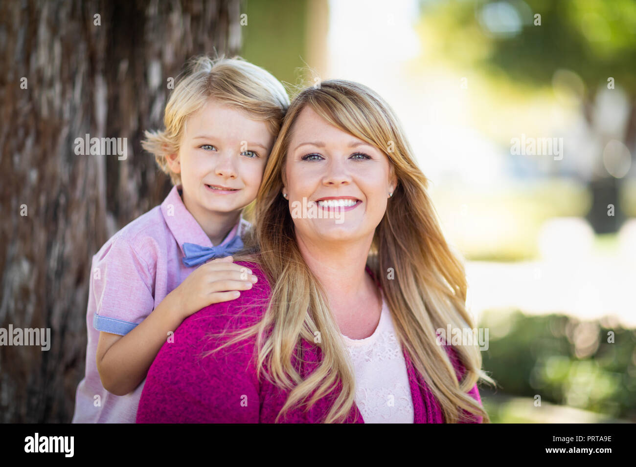 Young Caucasian Mother And Daughter Portrait At The Park. Stock Photo