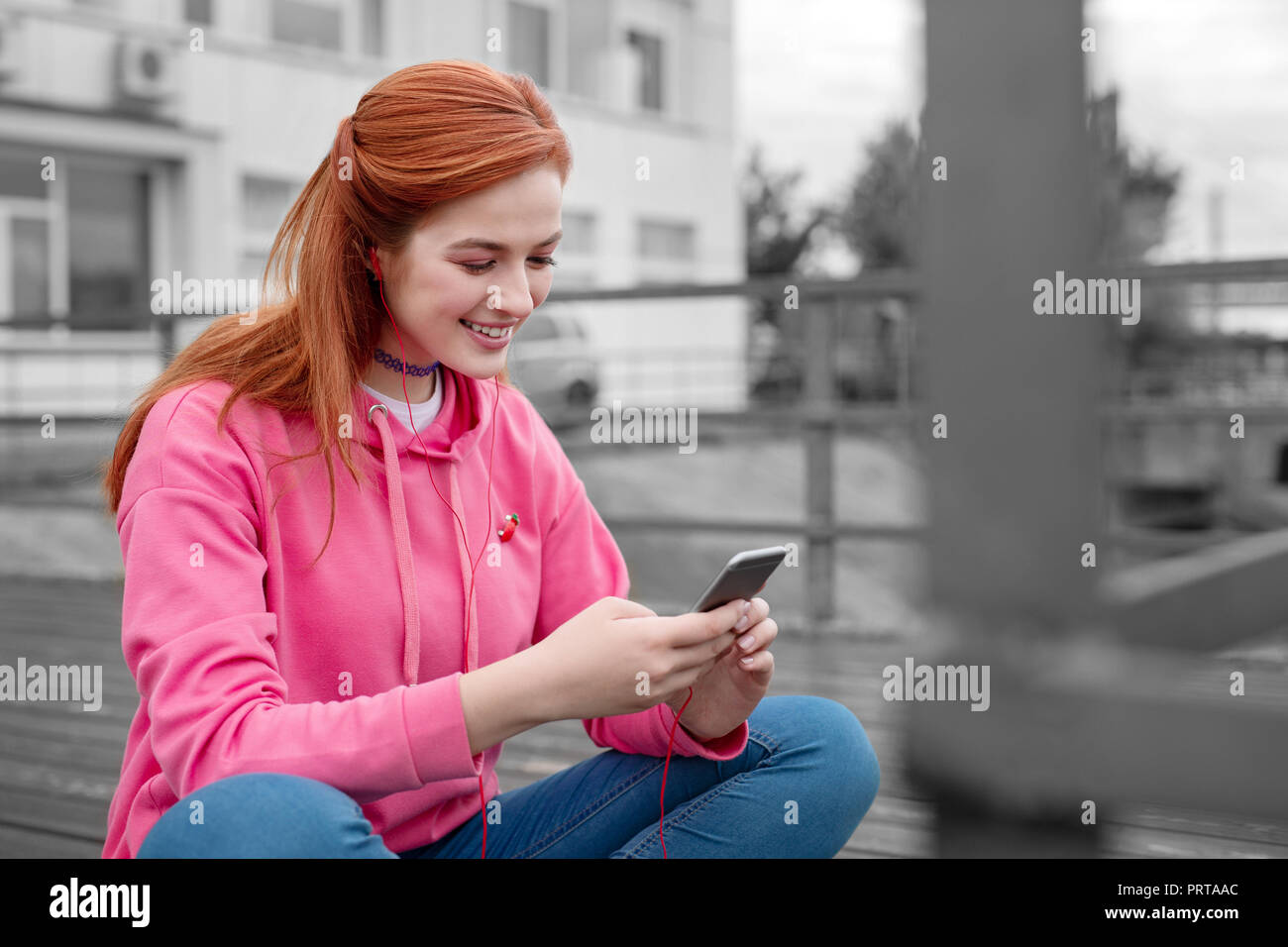 Young girl smiling while reading funny jokes in her smartphone Stock Photo - Alamy Young girl smiling while reading funny jokes in her smartphone Stock Photo - Alamy