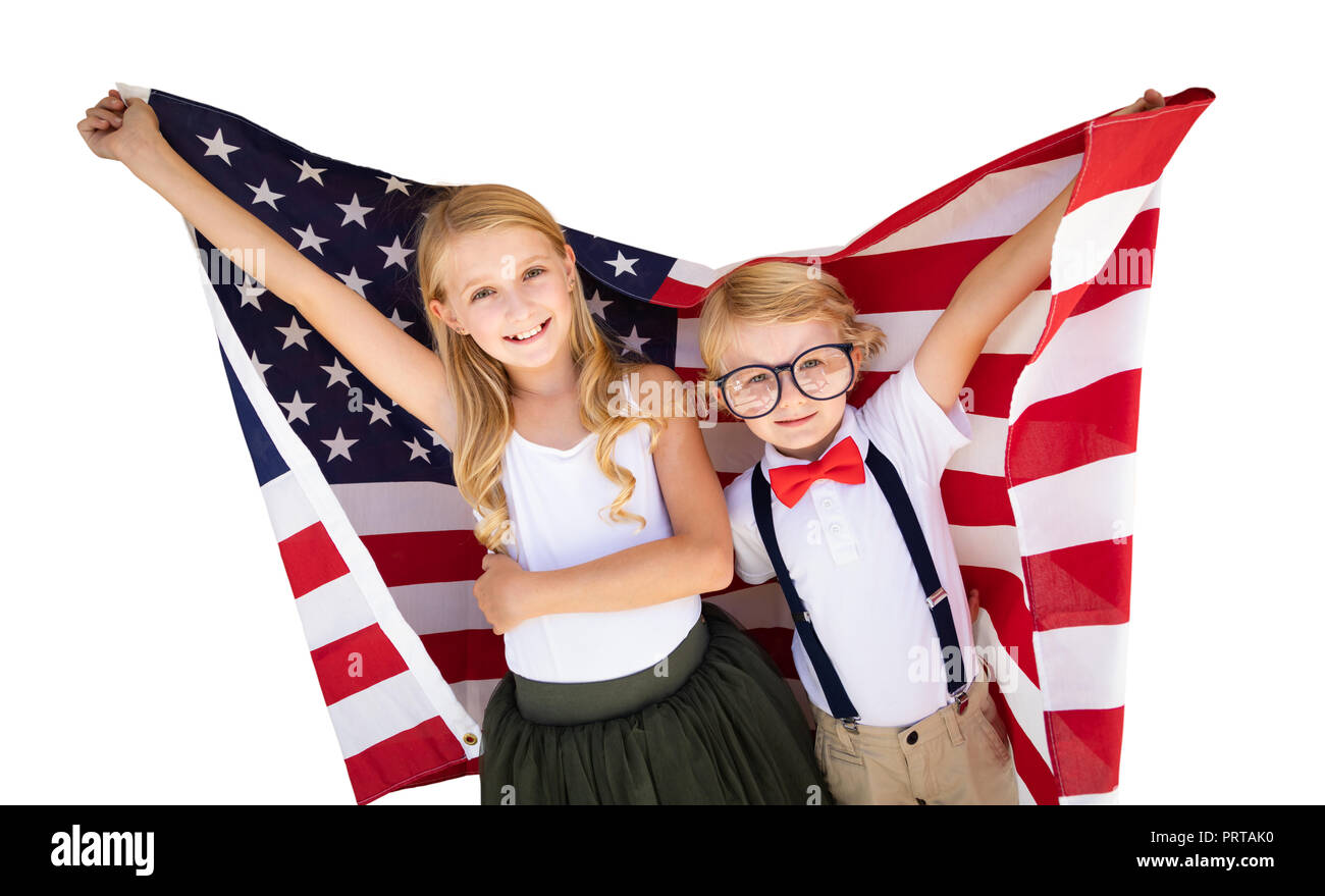 Cute Young Cuacasian Boy and Girl Holding American Flag Isolated On White Background. Stock Photo