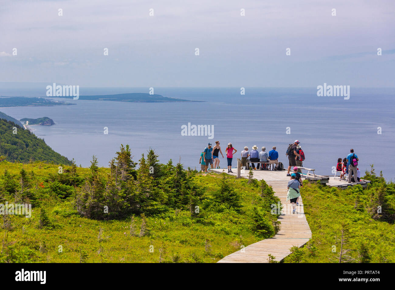 CAPE BRETON, NOVA SCOTIA, CANADA Hikers on boardwalk on Skyline Trail