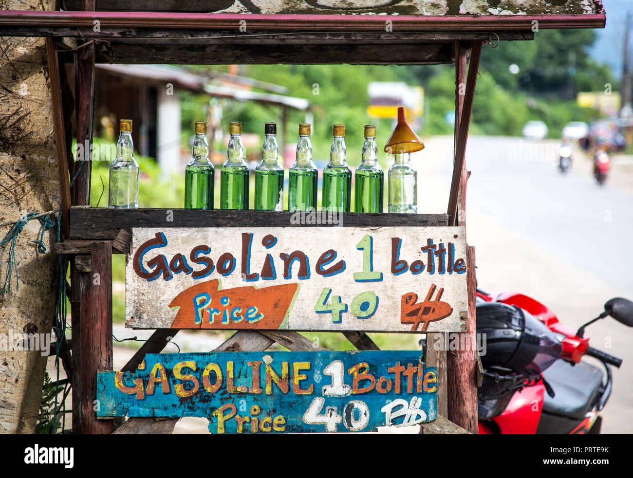 selling gasoline in glass bottles on Koh Chang, Thailand Stock Photo