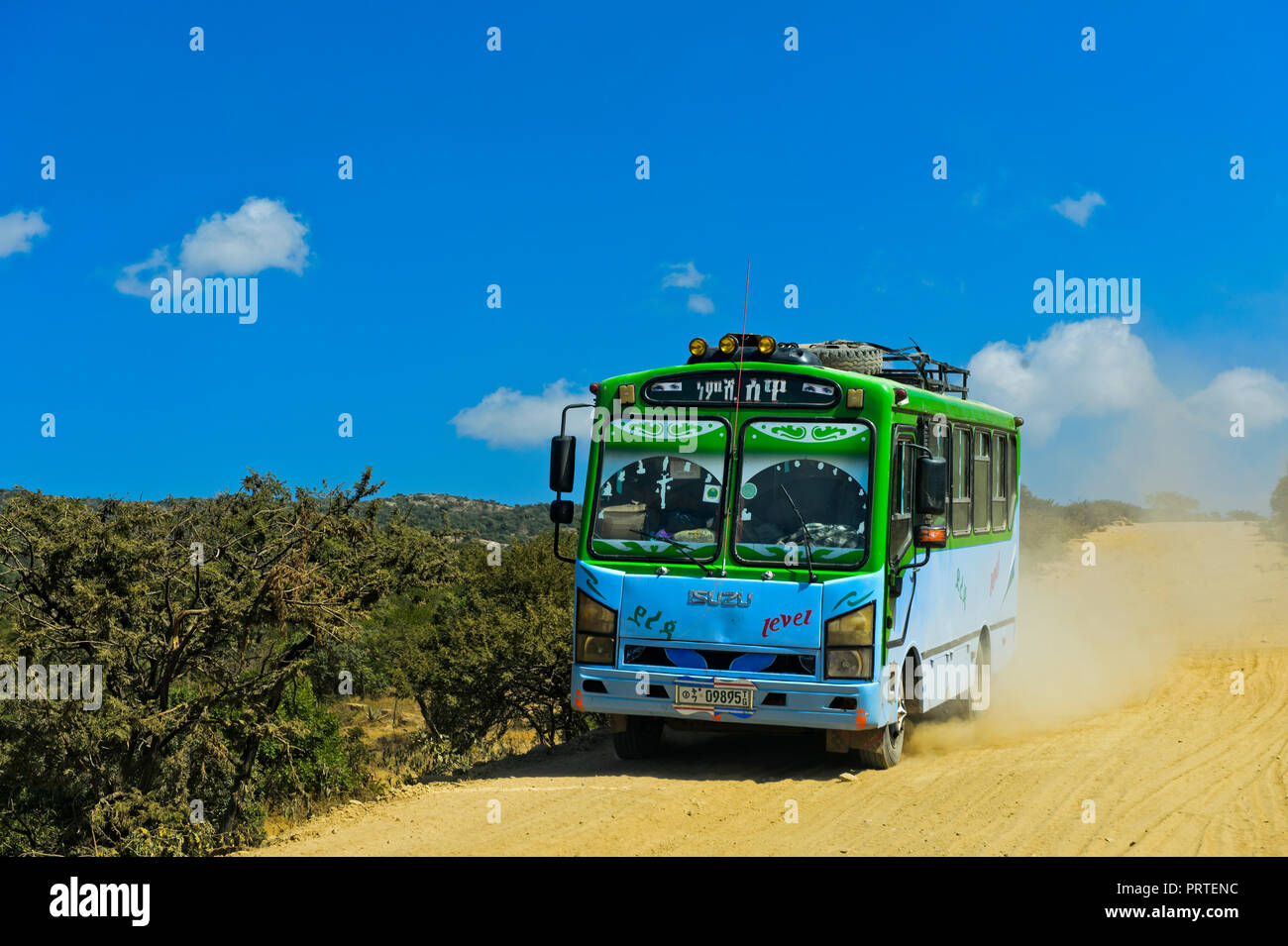 Bus on a dustry country road near Hawzien, Gheralta region,Tigray, Ethiopia Stock Photo