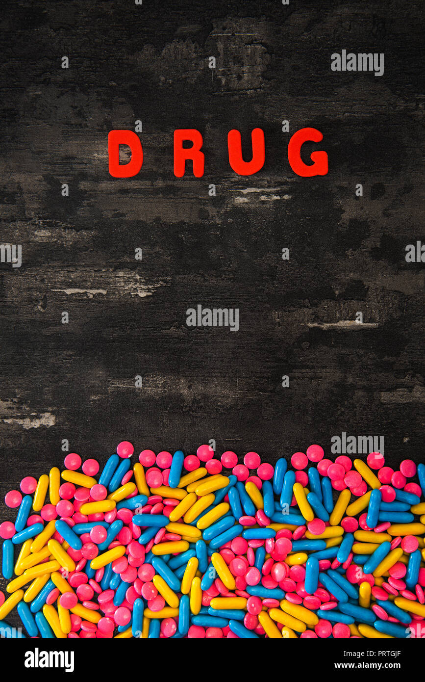 The word letters DRUGS and various medication and pills Stock Photo Alamy