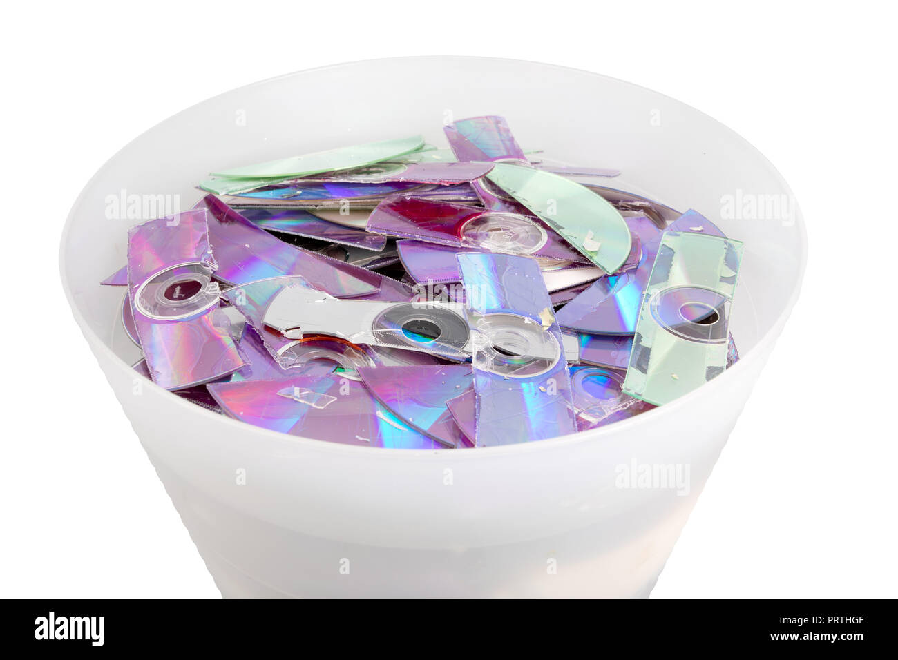 trash with stripes of shredded CD and DVD data disc destroyed by shredder Stock Photo