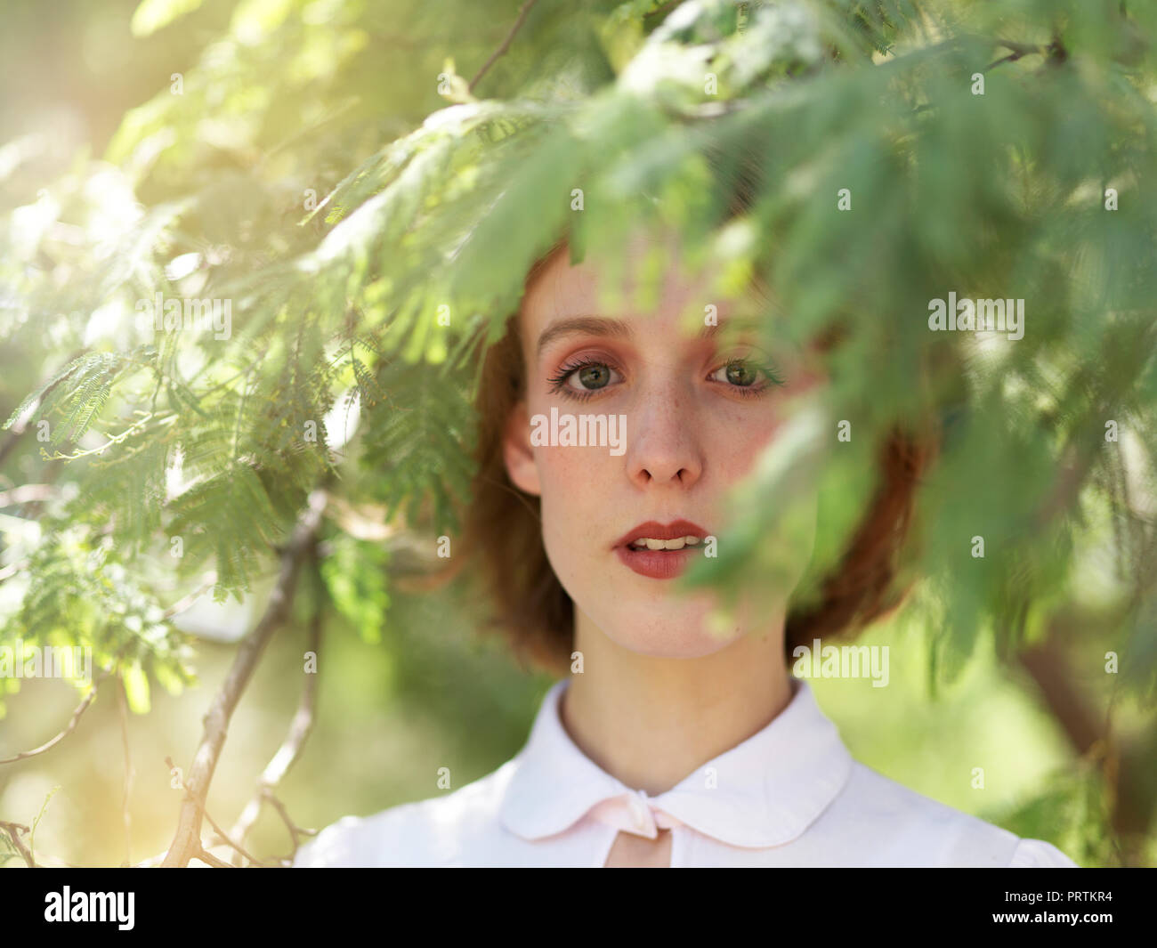 Portrait of young woman in nature Stock Photo