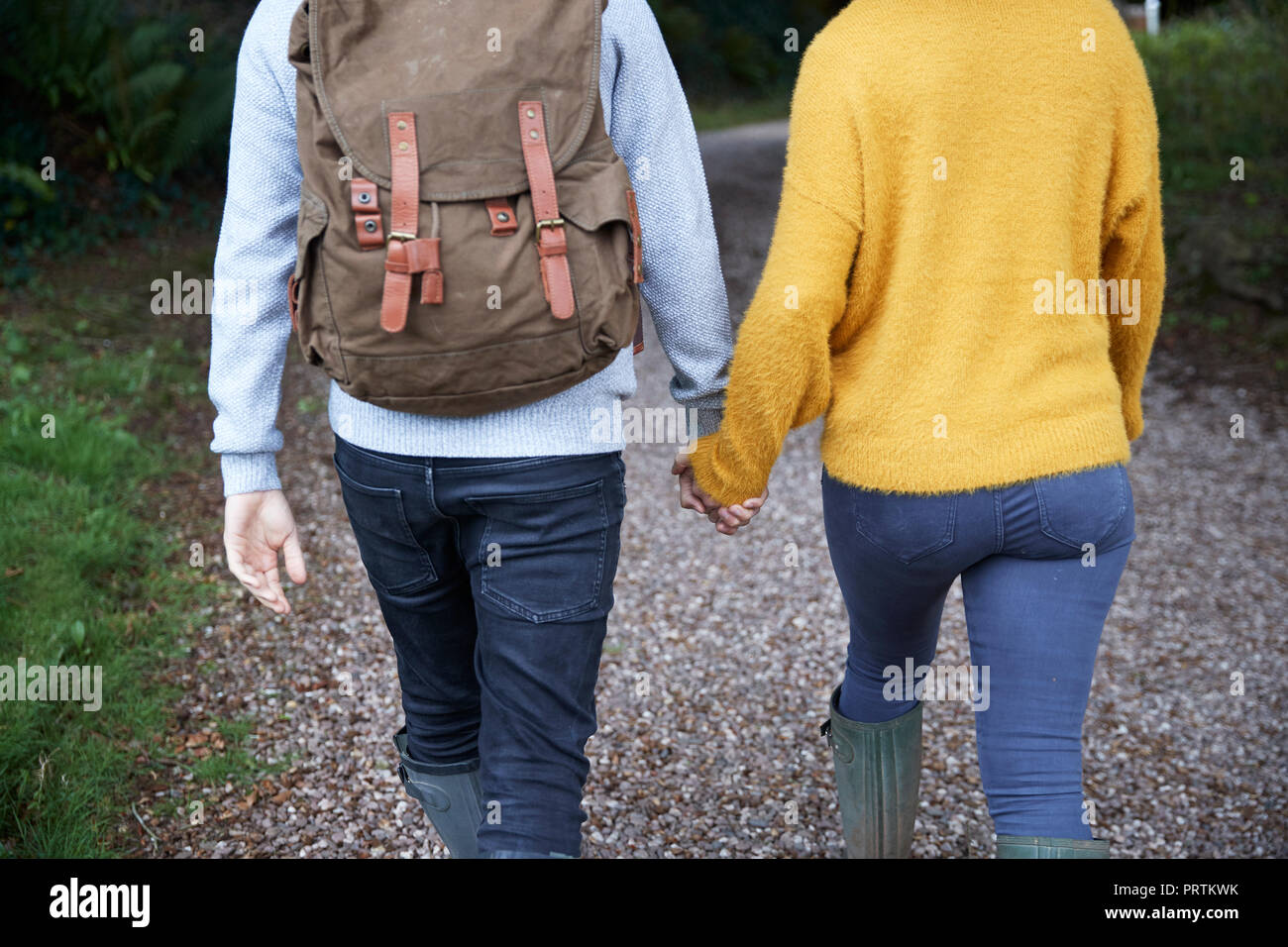 Hiker couple walking in countryside Stock Photo