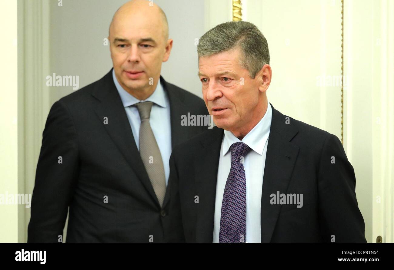 Russian Finance Minister Anton Siluanov, left, and Deputy Prime Minister Dmitry Kozak arrive for a meeting of Government ministers chaired by President Vladimir Putin at the Kremlin October 2, 2018 in Moscow, Russia. Stock Photo