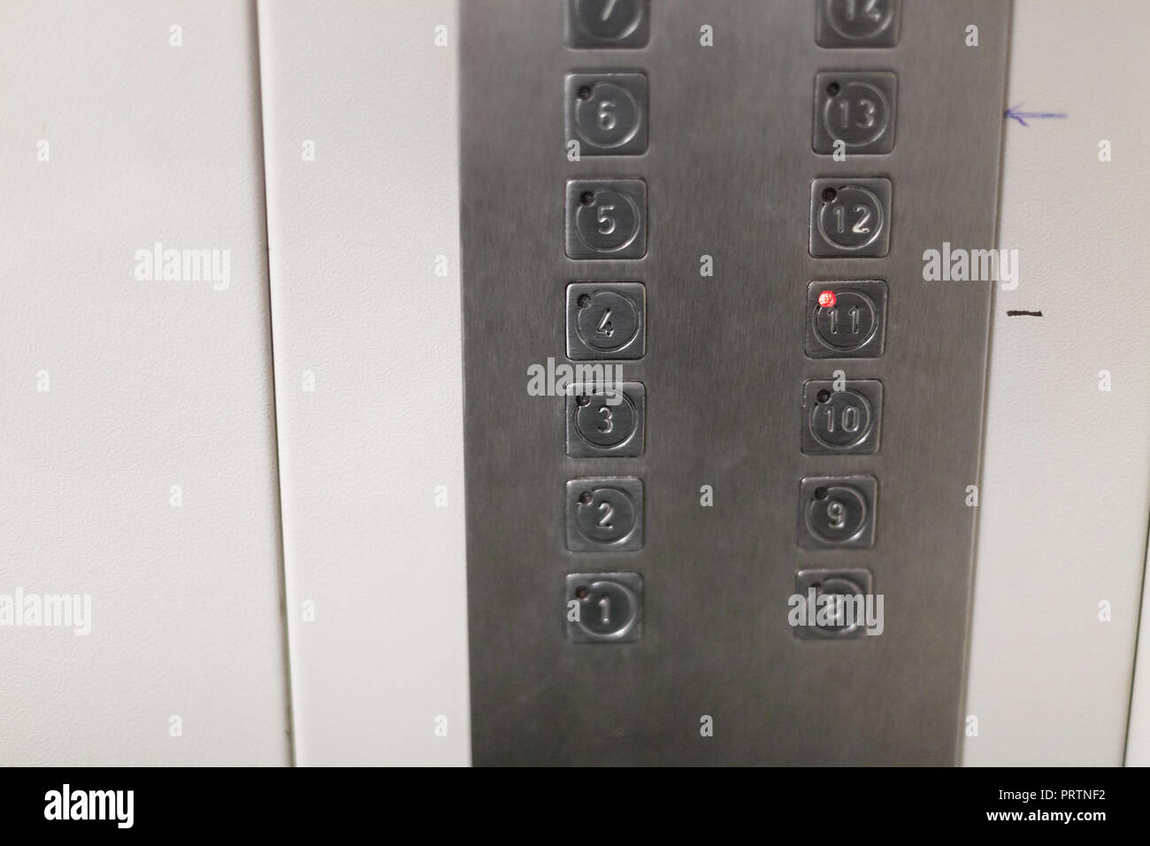 buttons in cabin of used elevator in urban apartment house Stock Photo