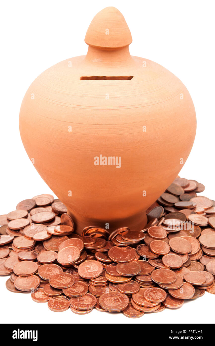 Clay piggy bank with coins on a white background Stock Photo - Alamy