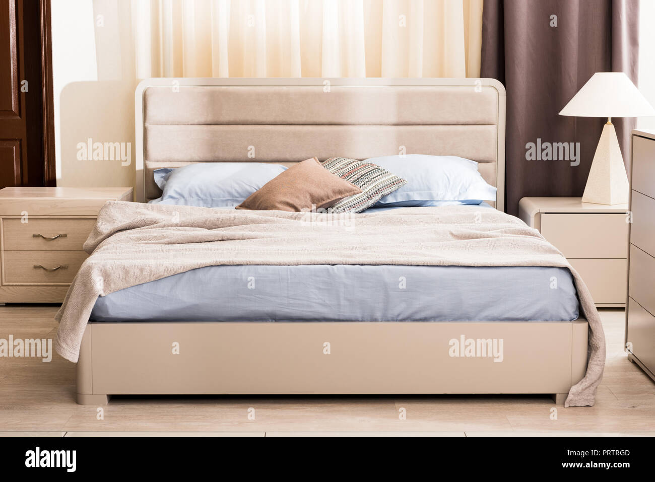 interior of modern bedroom with soft bed and pillows Stock Photo