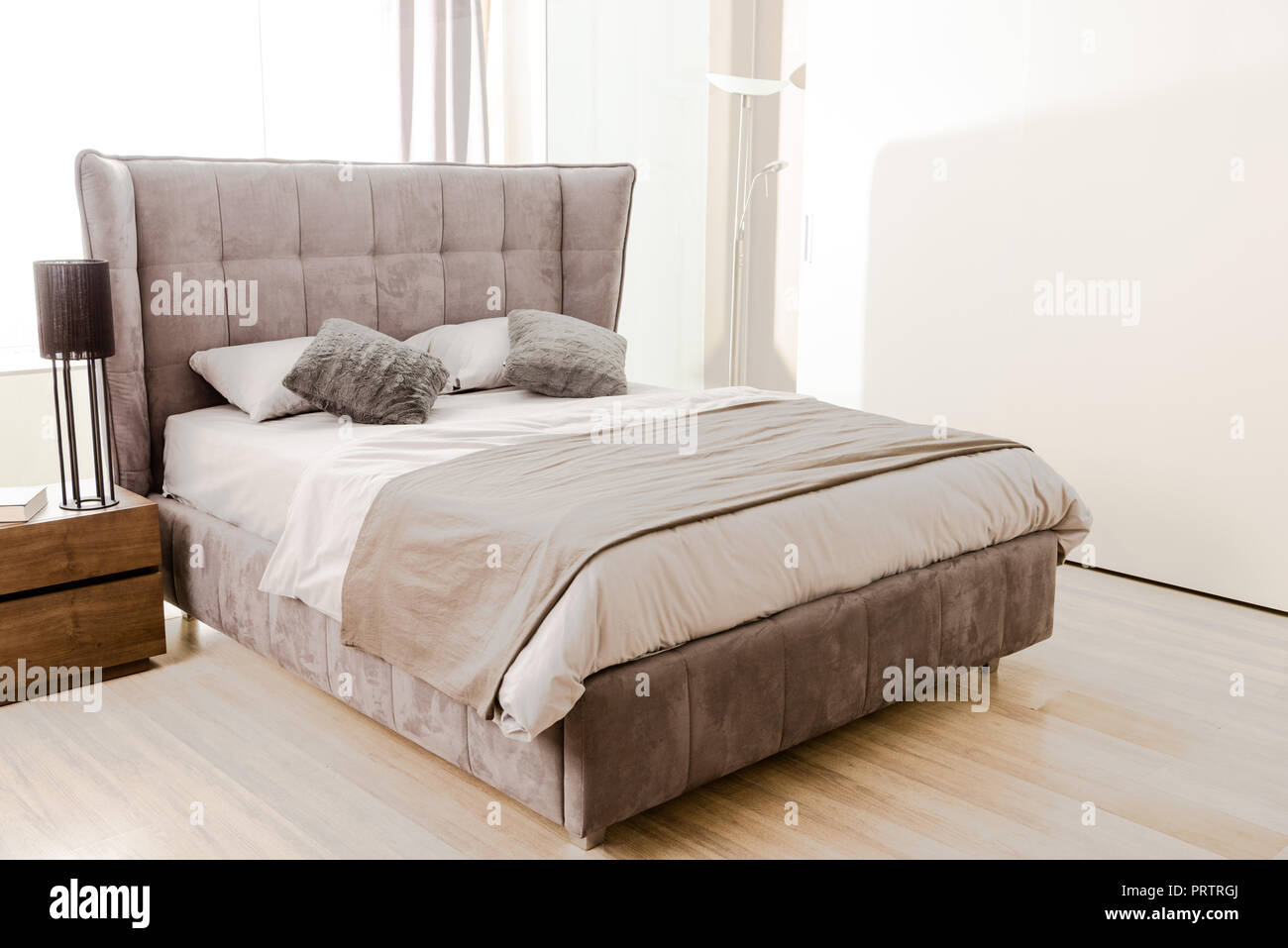 interior of modern bedroom with soft grey bed Stock Photo