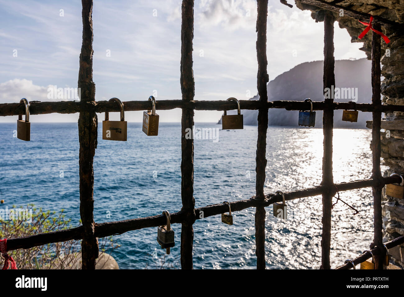 Padlocks hanging from a window on the sea, with promises of eternal love, Monterosso al mare, La Spezia, Liguria, Italy Stock Photo