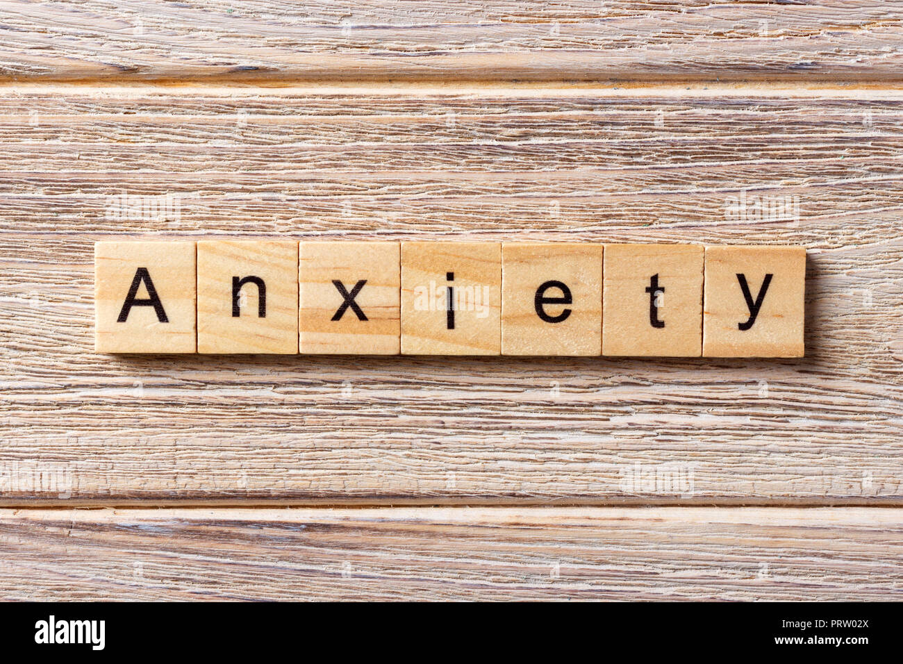 ANXIETY word written on wood block. ANXIETY text on table, concept. Stock Photo