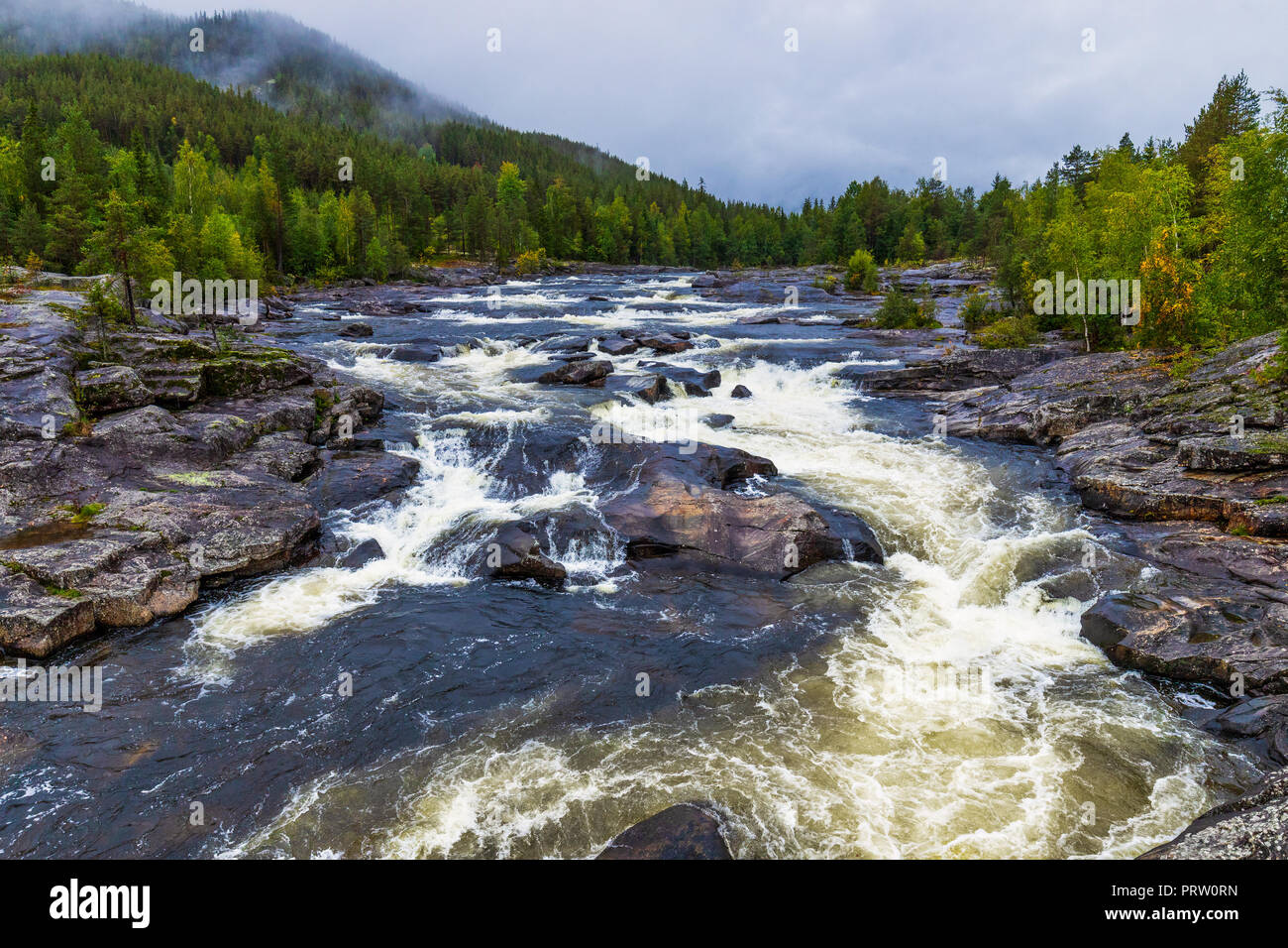 Halingdal river. A wild an natural river in Norway. The wild water is flowing through the rocks. The river is located between Oslo and Bergen. Stock Photo