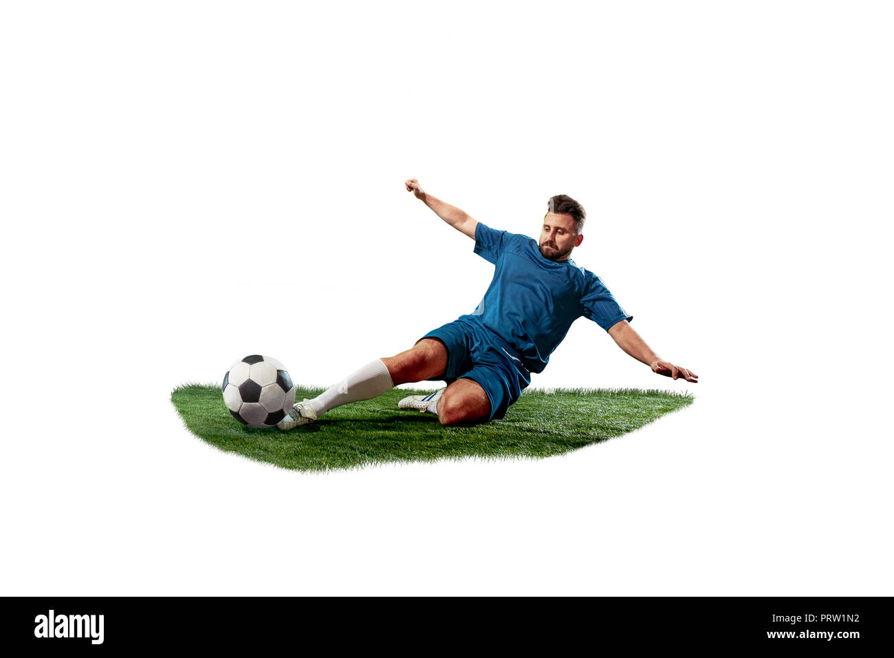 Football player tackling for the ball over white background. Professional  football soccer player in motion isolated on white studio background. Fit  fighting man in action, movement at game with ball Stock Photo 
