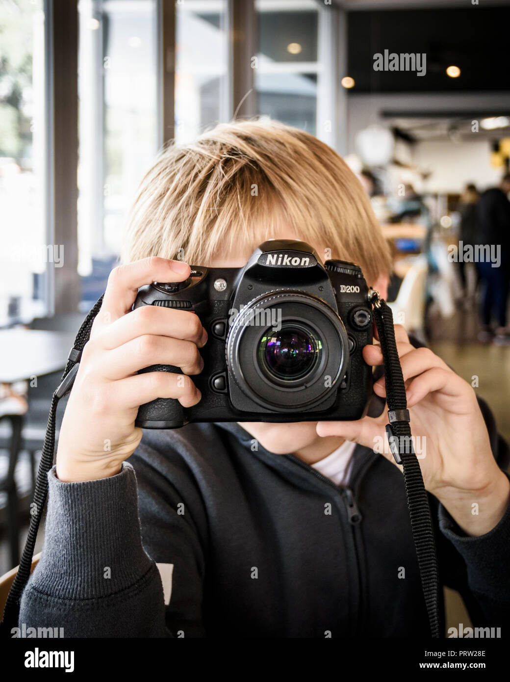 Young child with a DSLR camera Stock Photo