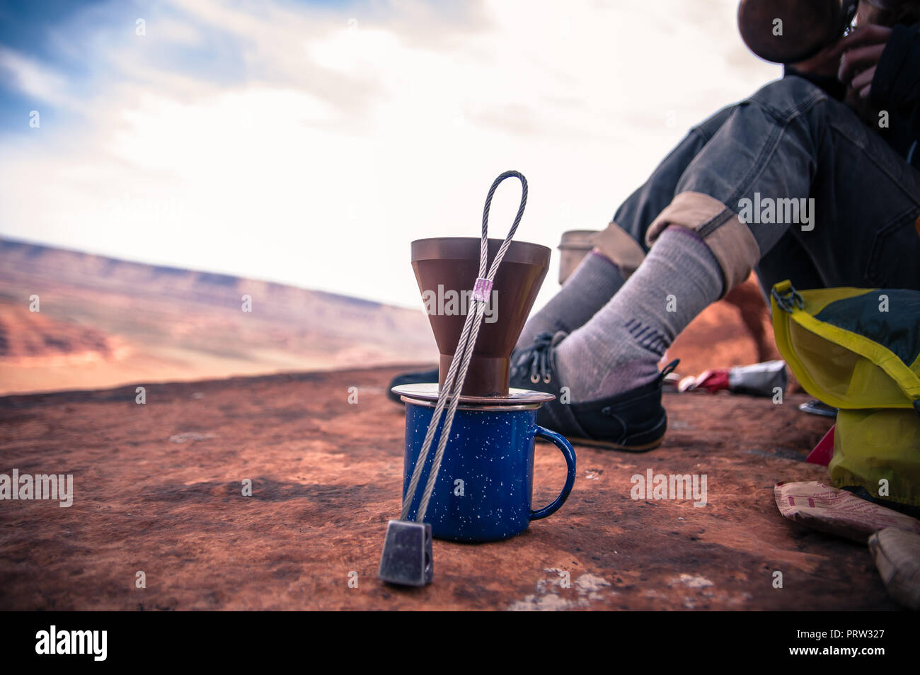 Rock climber making coffee, Desert Towers, Indian Creek, Moab, Utah, USA Stock Photo