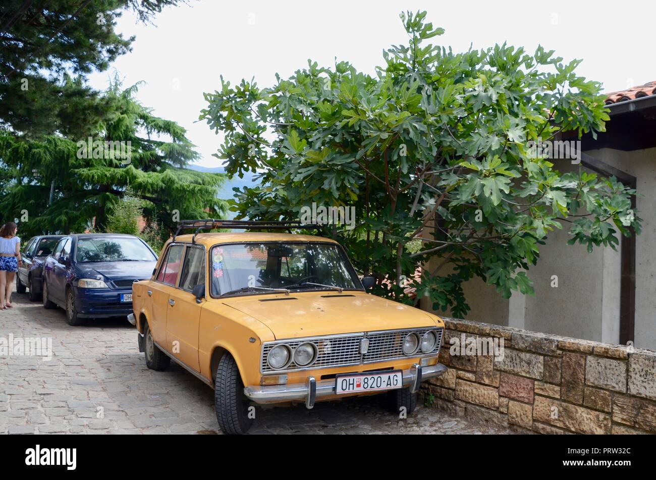 an old orange yugo car parked in ohrid macedonia Stock Photo