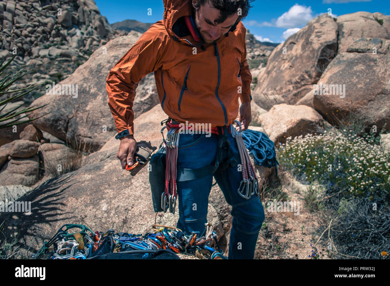 Rock climber wearing safety gear, Joshua Tree, California, USA Stock Photo