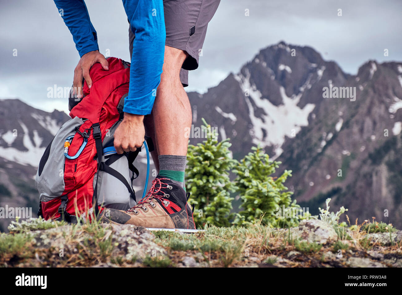 Hiker taking break, Mount Sneffels, Ouray, Colorado, USA Stock Photo