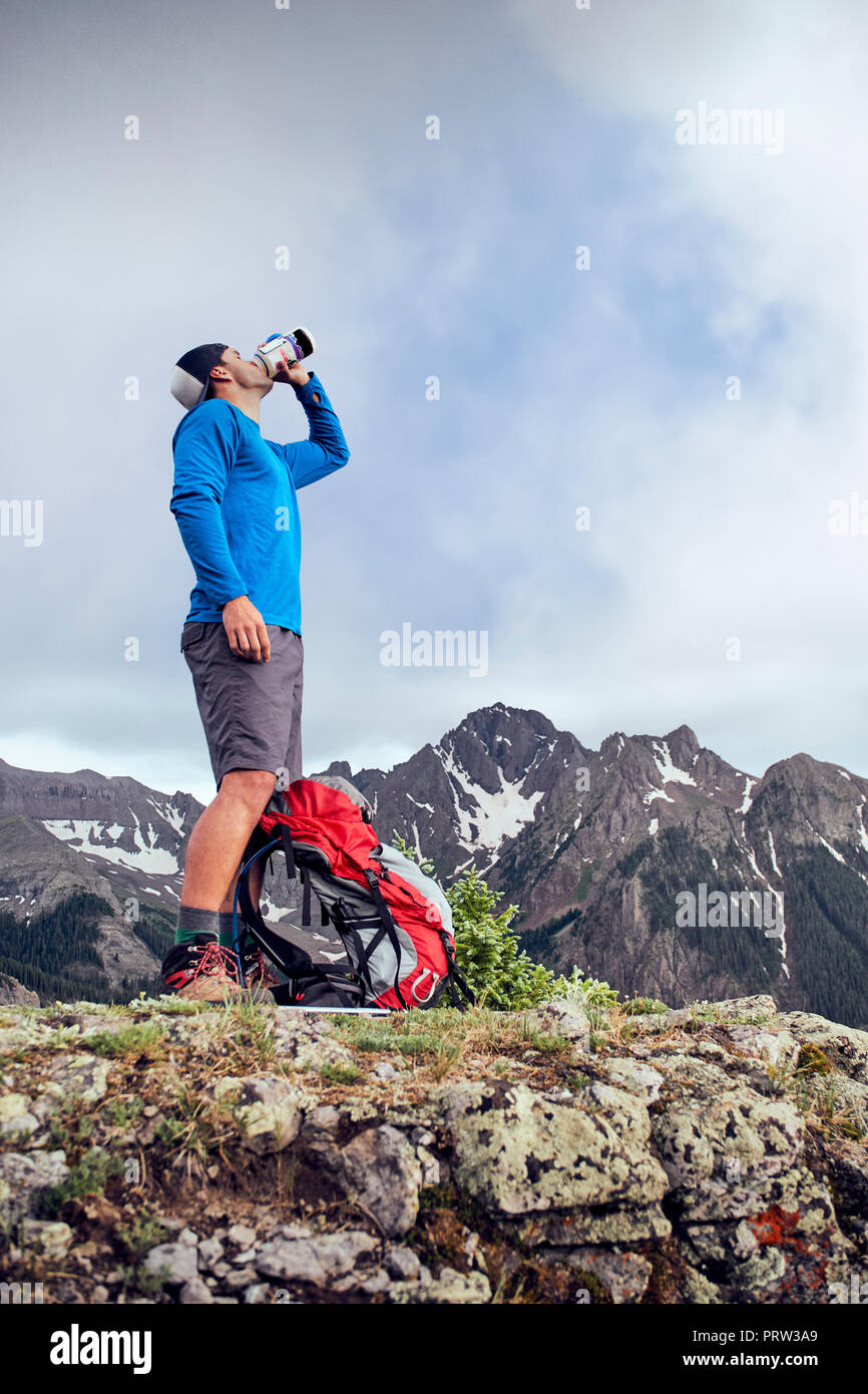 Hiker taking break, Mount Sneffels, Ouray, Colorado, USA Stock Photo