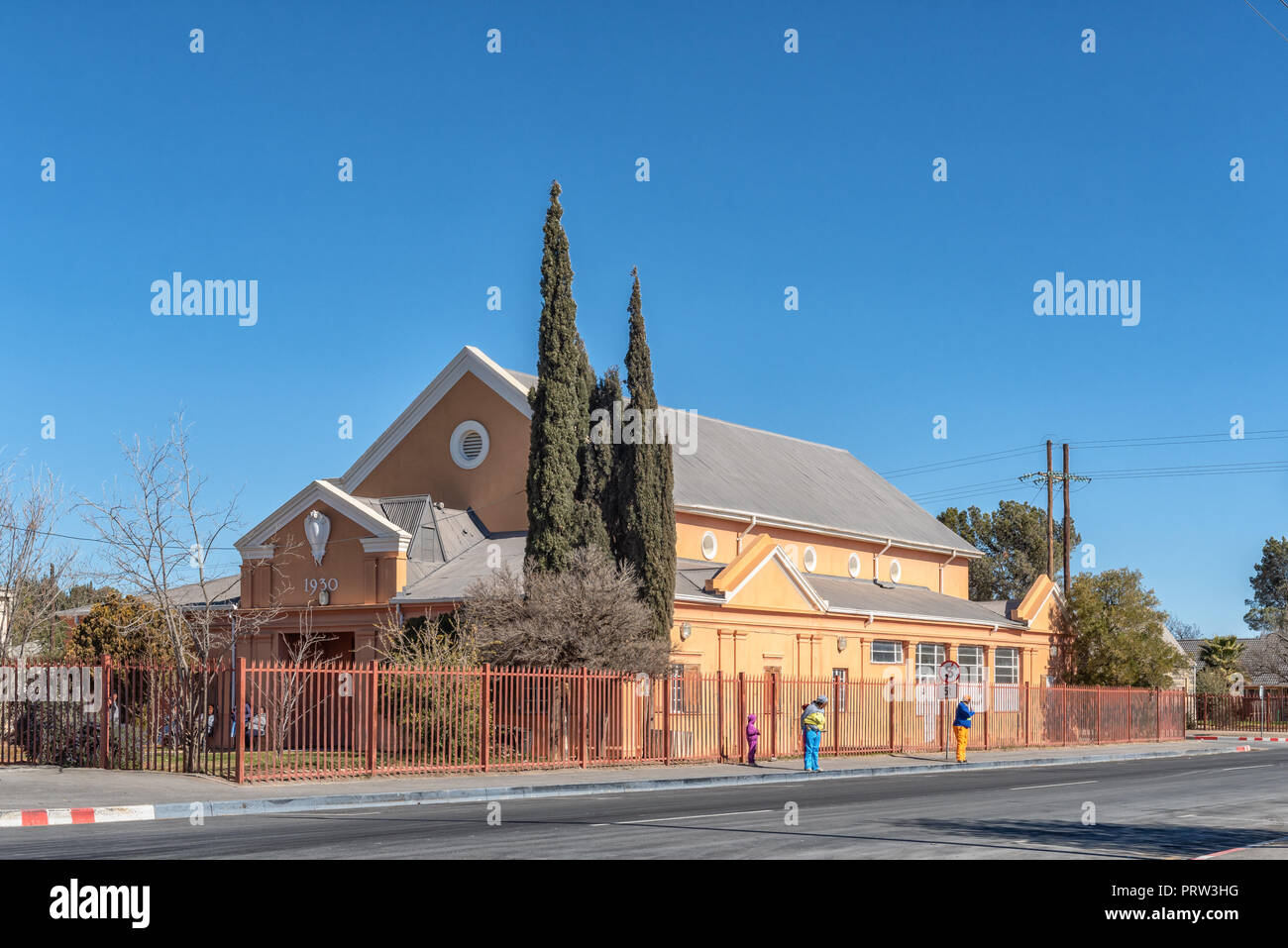 BRITSTOWN, SOUTH AFRICA, AUGUST 6, 2018: A street scene, with an historic building, in Britstown in the Northern Cape Province. People are visible Stock Photo