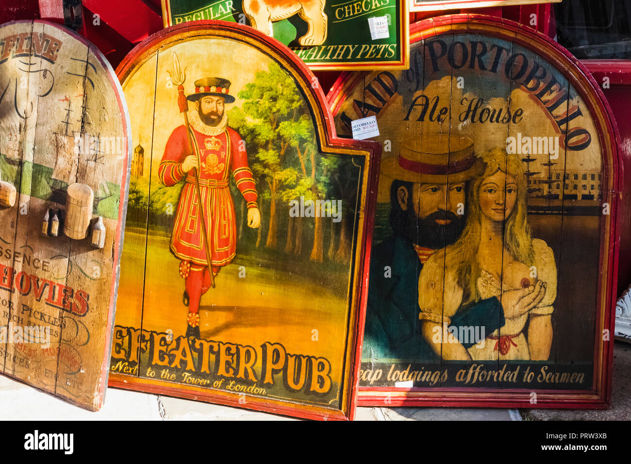 England, London, Notting Hill, Portobello Road, Antique Shop Display of Vintage Shop and Pub Signs Stock Photo