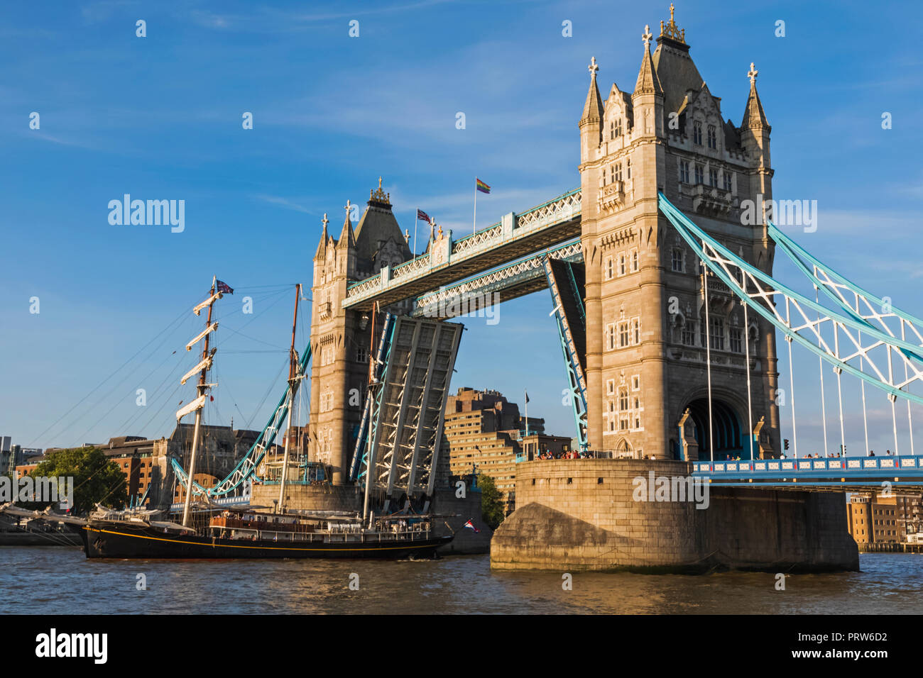 England, London, Sailing Ship Passing Through Tower Bridge Stock Photo