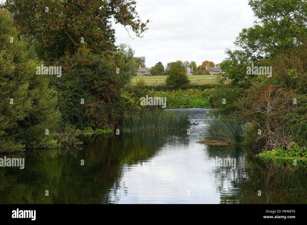 A view across the Nene to the village of Ashton Stock Photo