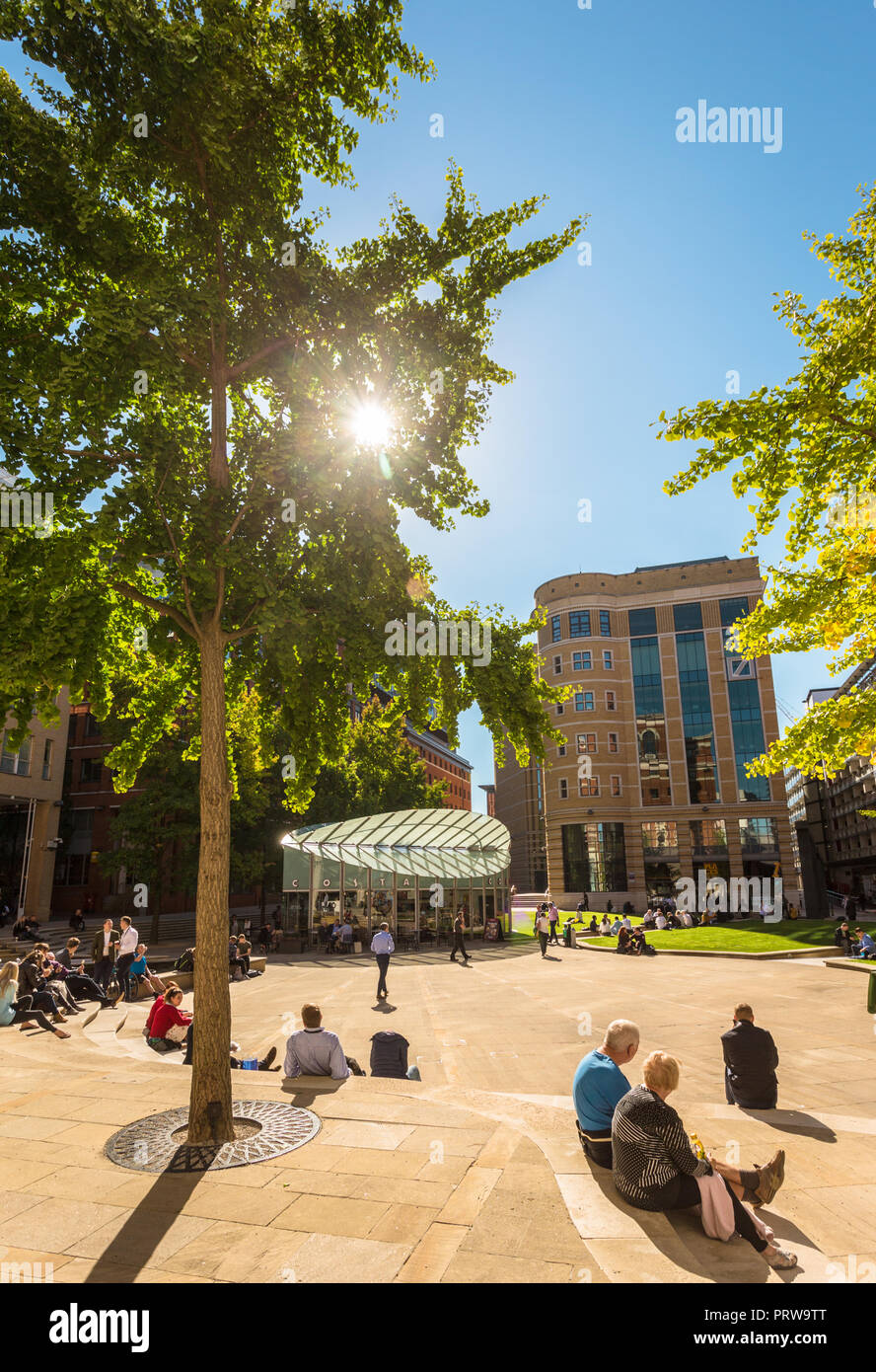 Central Square, Brindley Place, with people relaxing in late summer sunshine and warmth, Birmingham UK Stock Photo