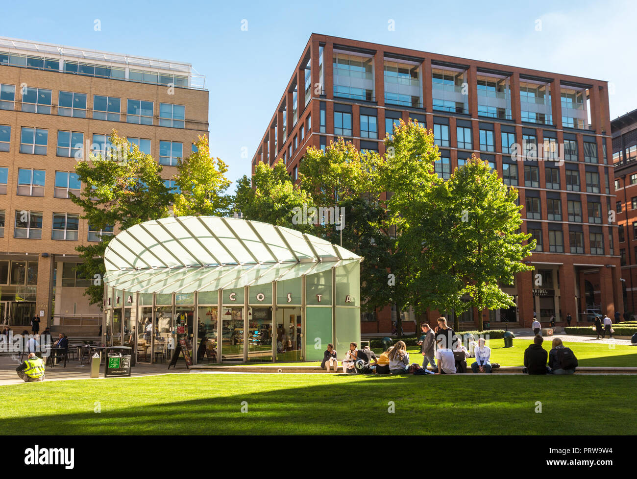 Central Square, Brindley Place, with people relaxing in late summer sunshine and warmth, Birmingham UK Stock Photo