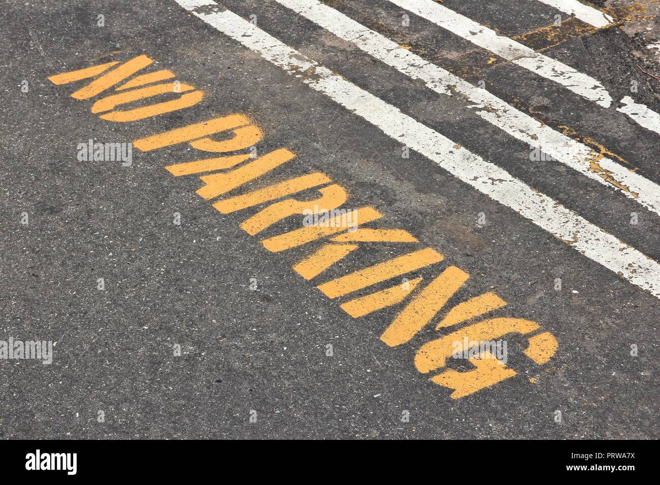 No parking sign stencil painted onto street pavement Stock Photo Alamy