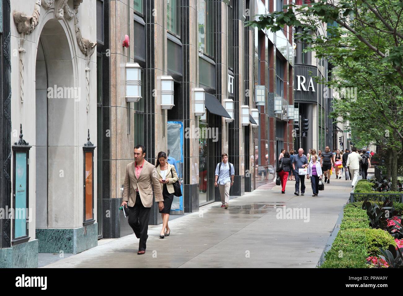 CHICAGO, USA - JUNE 26, 2013: People walk the famous Magnificent Mile of Michigan Avenue in Chicago. It is Chicago's major shopping destination and on Stock Photo