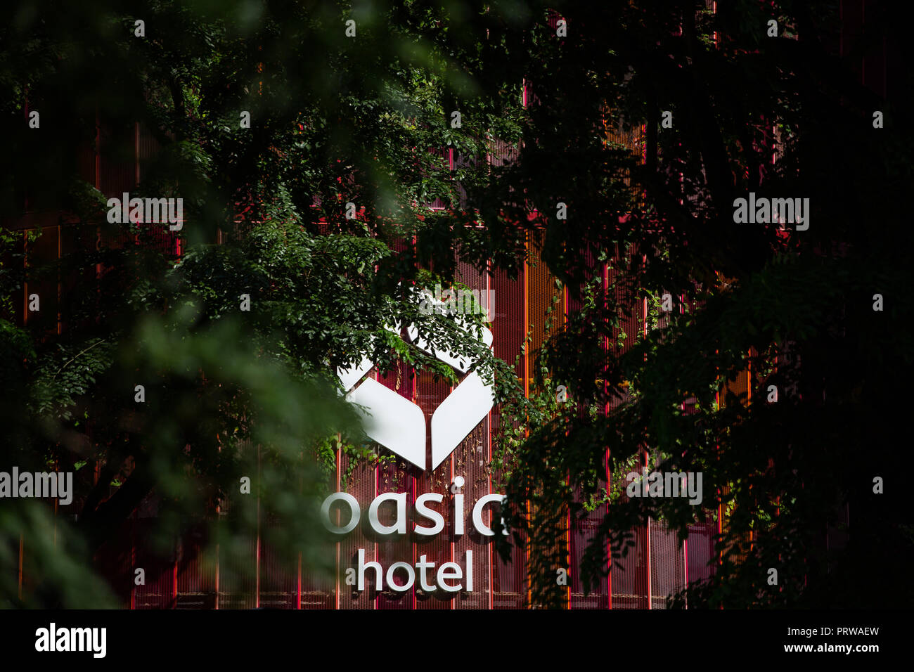 Oasia Hotel Downtown drape with lush green, Singapore Stock Photo