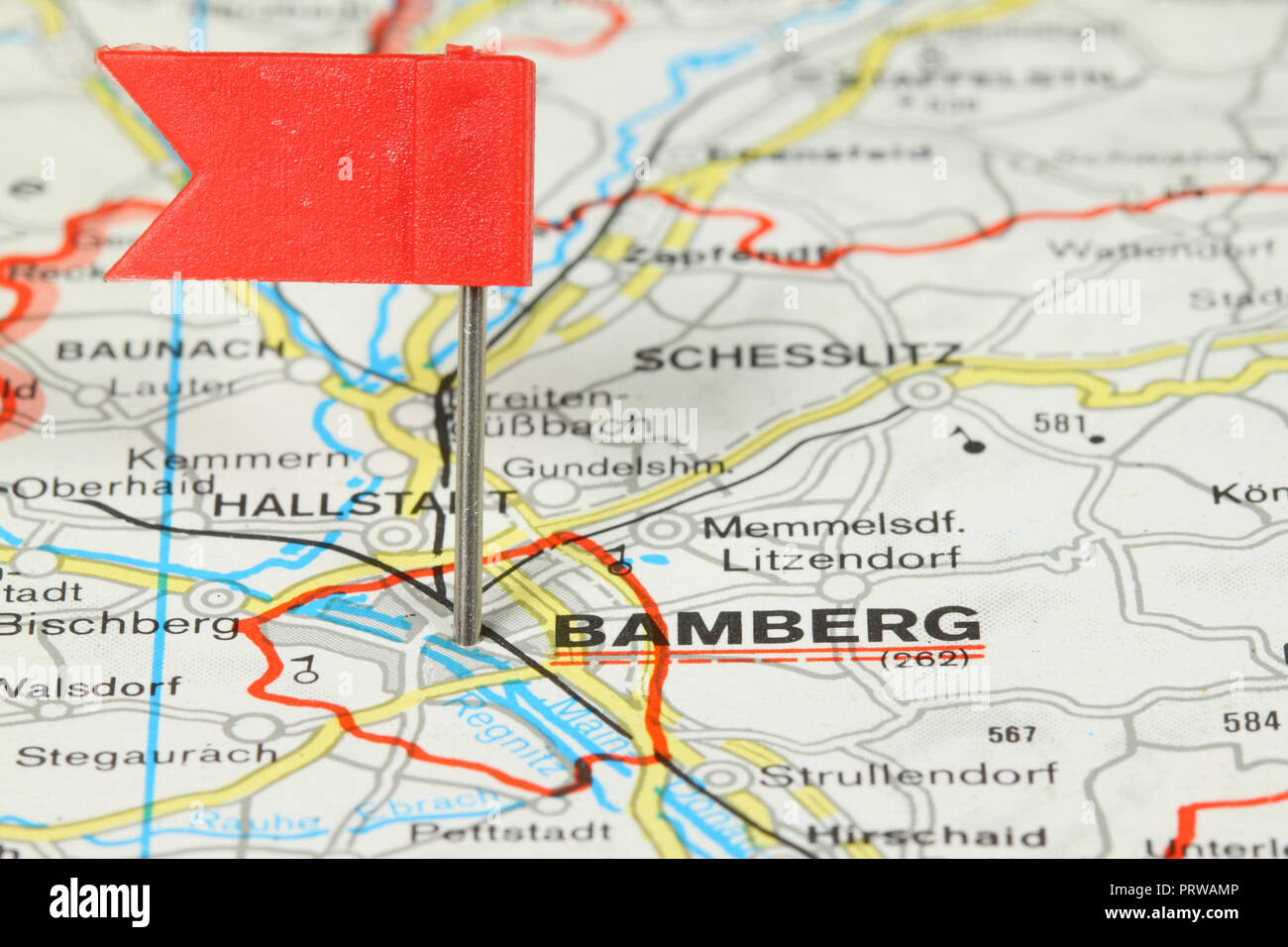 Bamberg city in Germany. Red flag pin on an old map showing travel