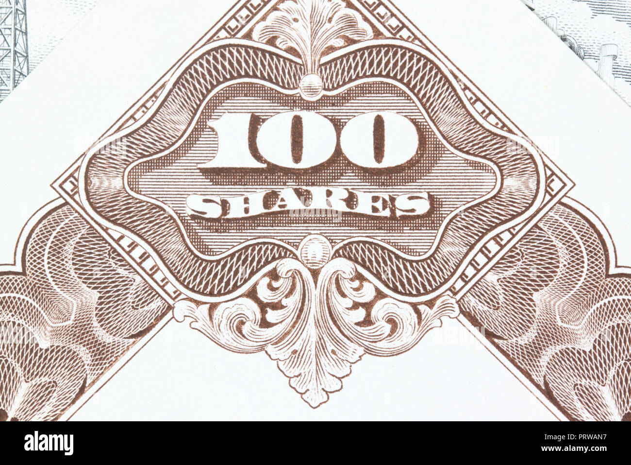 100 shares. Old stock share certificate. Vintage scripophily objects. Stock Photo