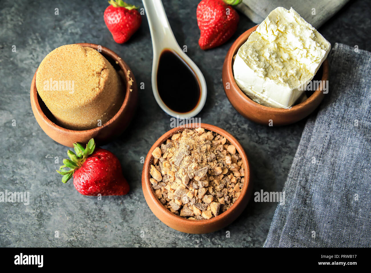 Creamy Chocolate English Toffee Fruit Dip made with 3 ingredients -  cream cheese, Mexican vanilla, brown sugar, served in bamboo and marble bowl Stock Photo