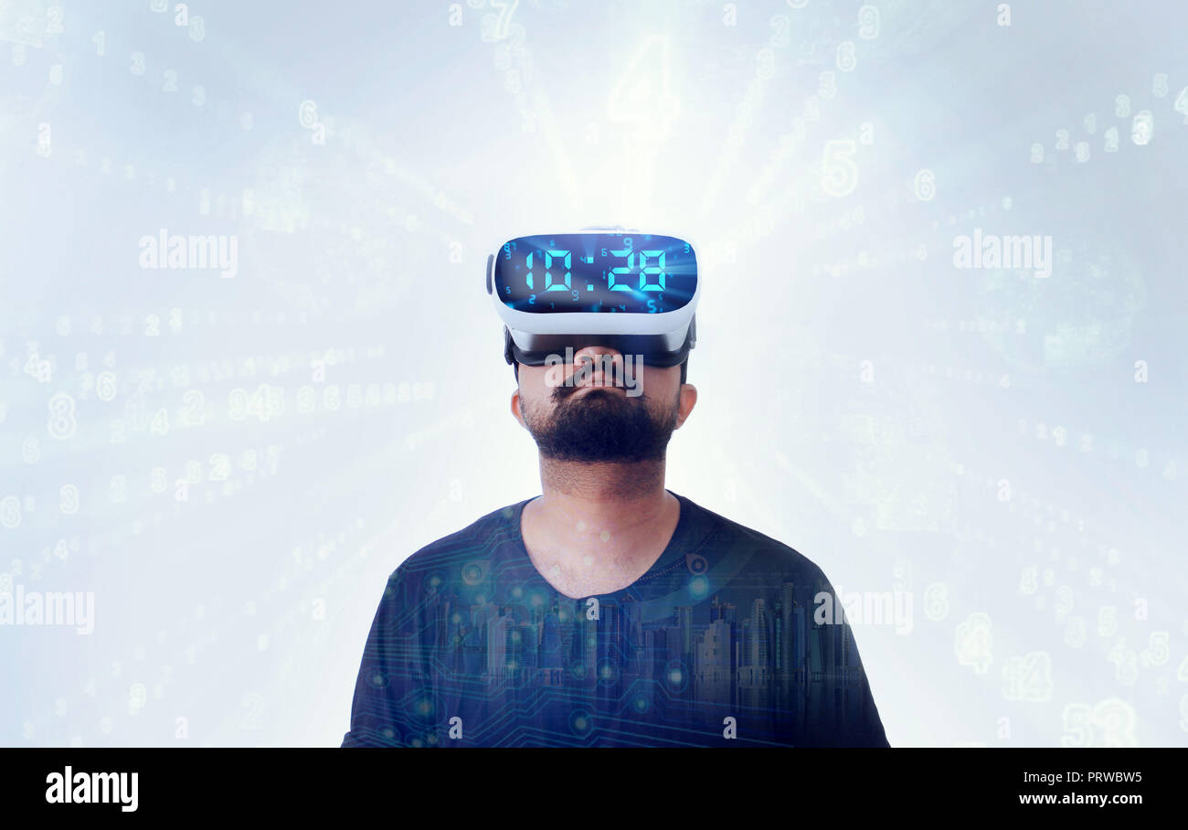Young Guy in black t shirt wearing VR Virtual Reality glasses Stock Photo