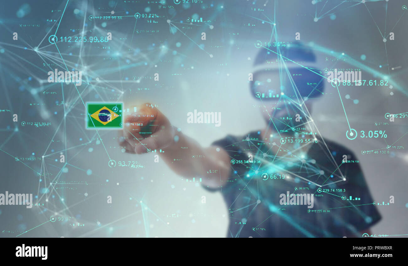 Brazil Flag In Metaverse looking through VR (Virtual Reality) glasses - Pointing Finger on screen Stock Photo