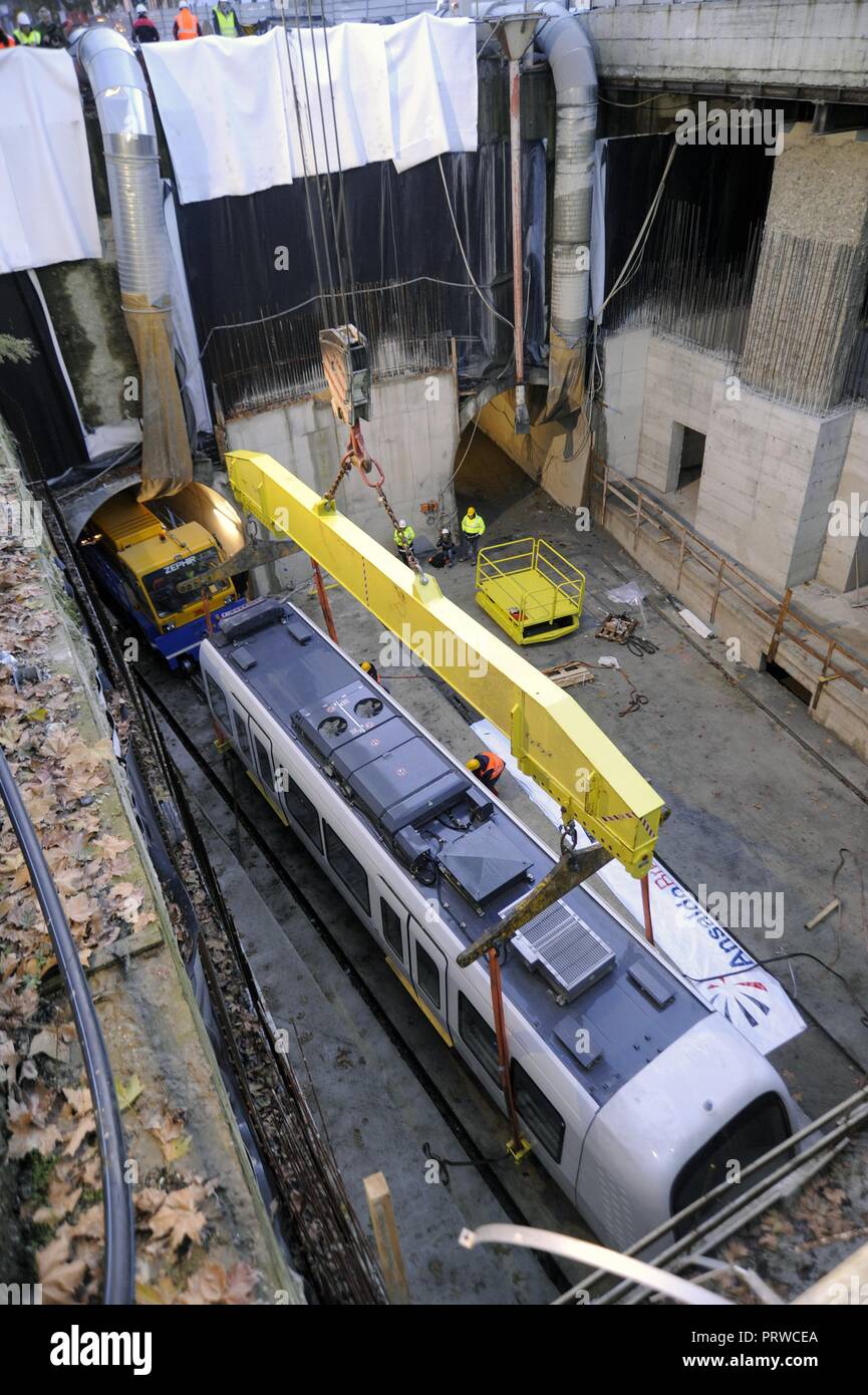 Milan (Italy), site for construction of new subway line number 5; the first car of the train is lowered into the tunnel for driving tests Stock Photo