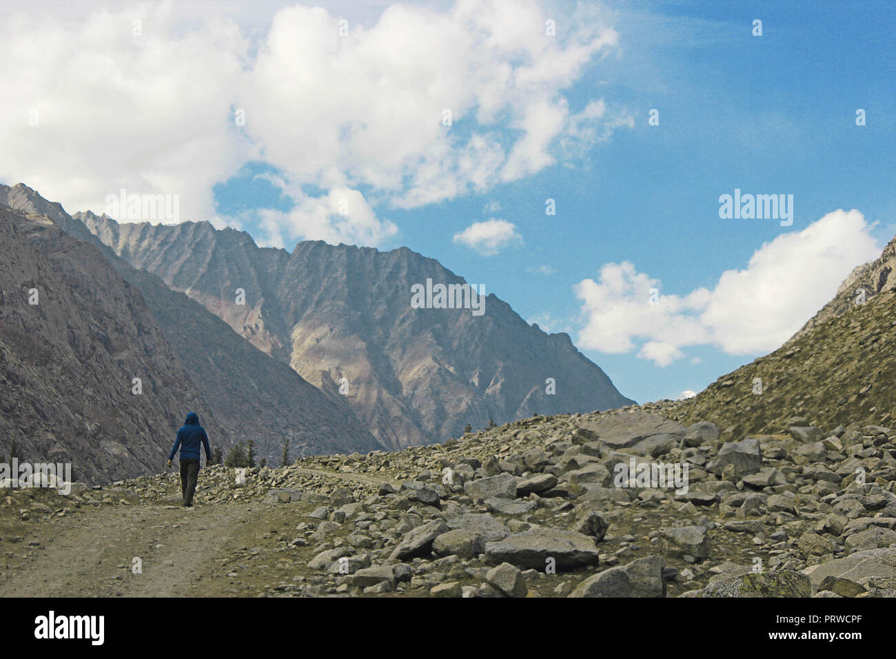 A man walking in the mountains alone in mahodand lake, swat KPK, Pakistan Stock Photo