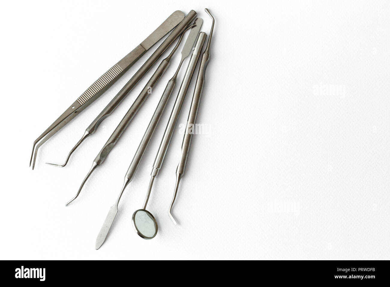 Professional Dentist tools in dental office dentist mirror, forceps