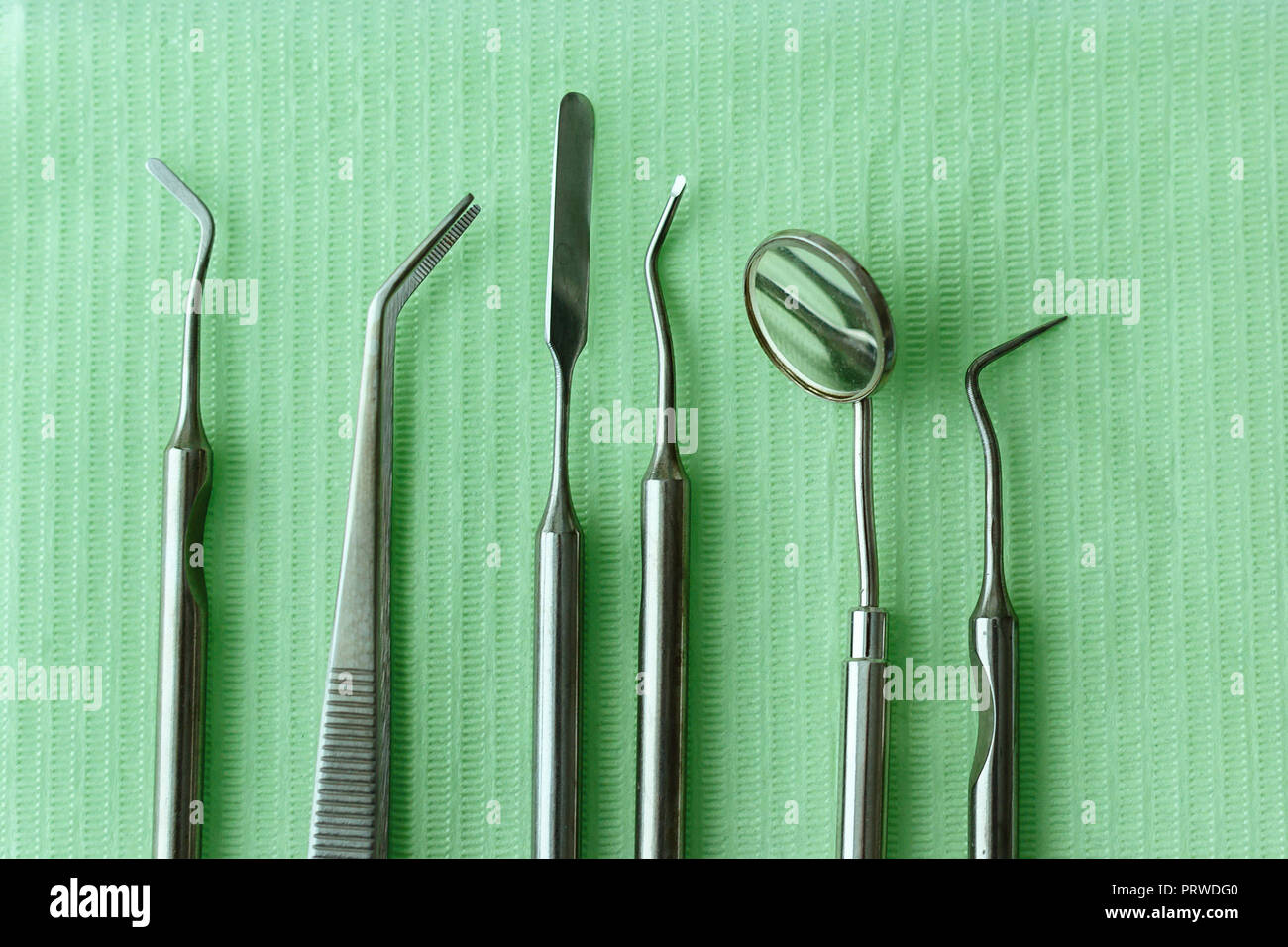 Professional Dentist tools in dental office dentist mirror, forceps