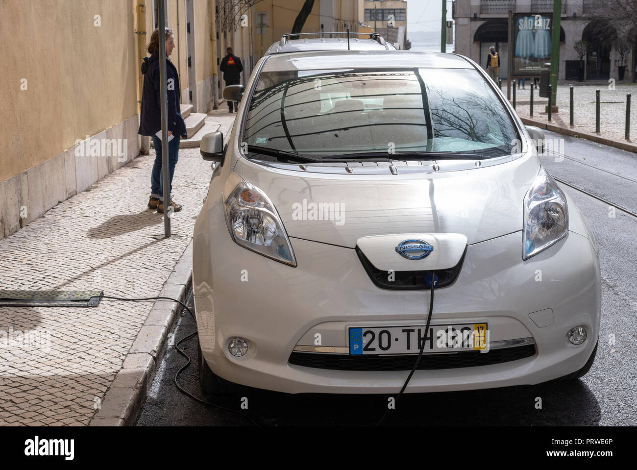 Nissan Leaf being recharged on the street in Lisbon, Portugal Stock Photo