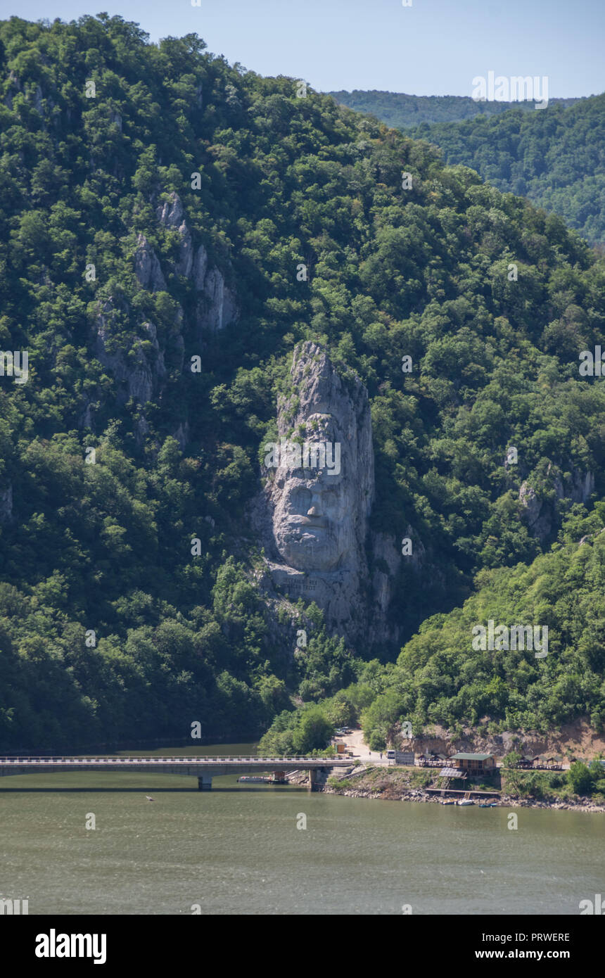 Decebal Head sculpted in rock, Danube Gorges (Cazanele Dunarii) , Romania. Aerial view. Stock Photo
