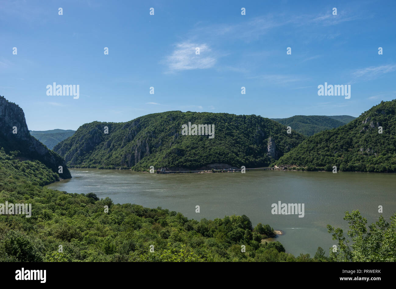 Panarama of Danube river with Decebalus Head sculpted in rock, Danube Gorges (Cazanele Dunarii) , Romania. Stock Photo