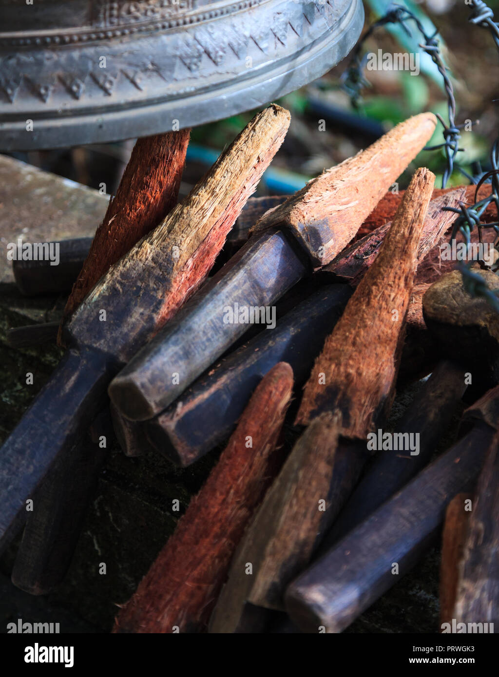 Ring or chime the bells in temple with wood sticks. The Bell symbolizes