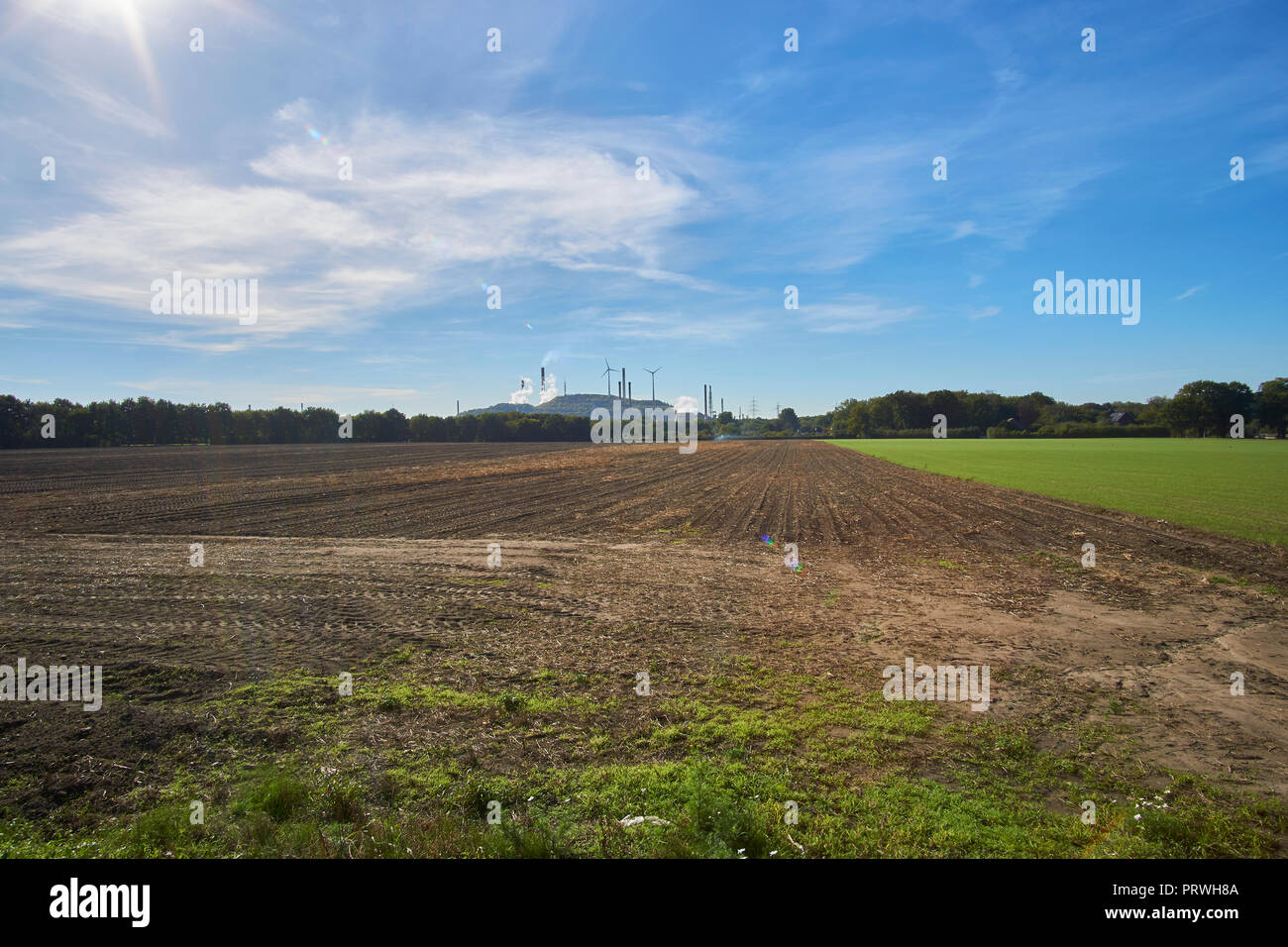 coal fired power station on a small mountain and a field Stock Photo